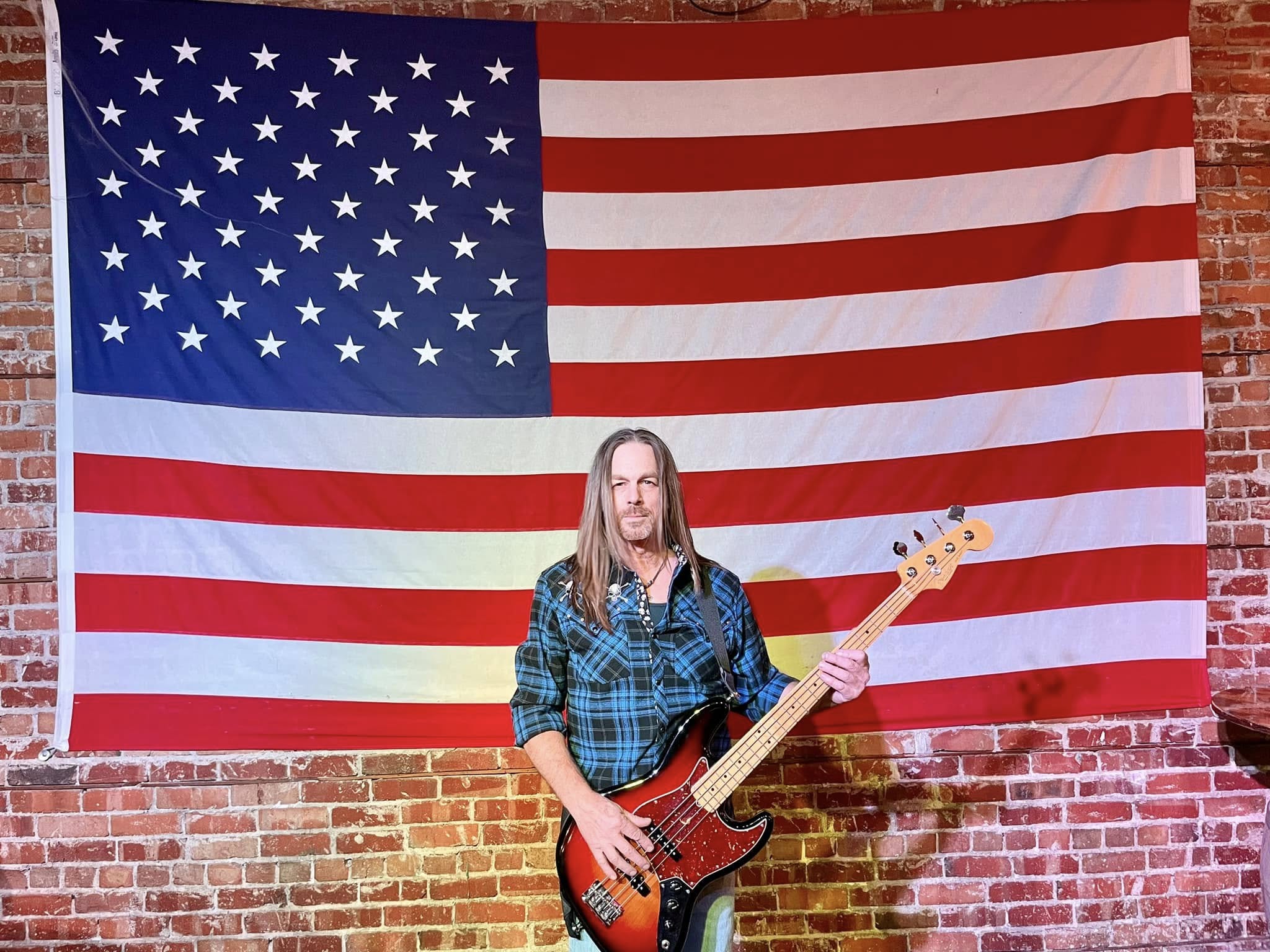 Chris Scoville infront of an american flag