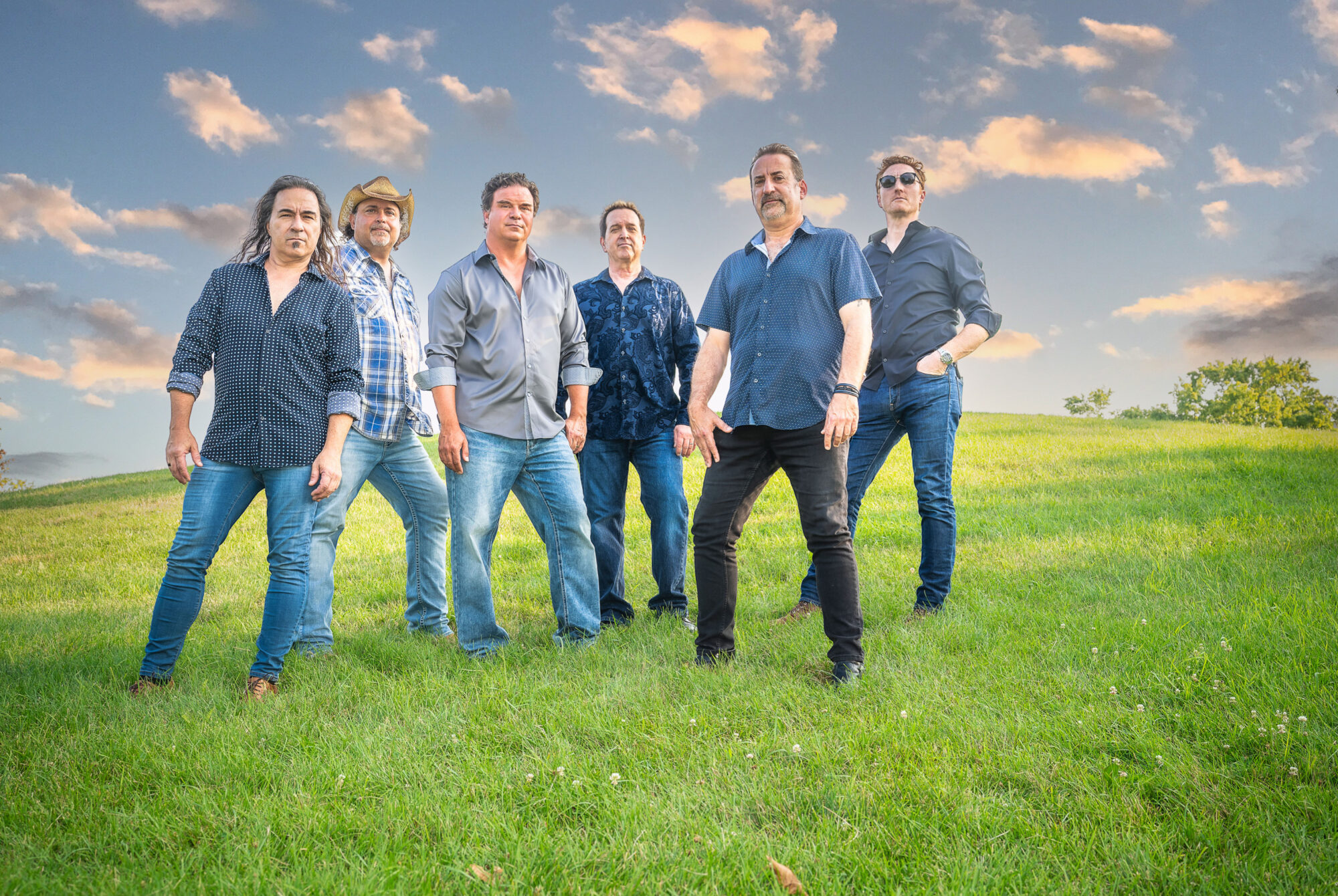 Six band members on a hill