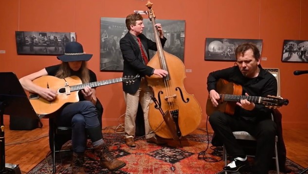 Three people playing instruments