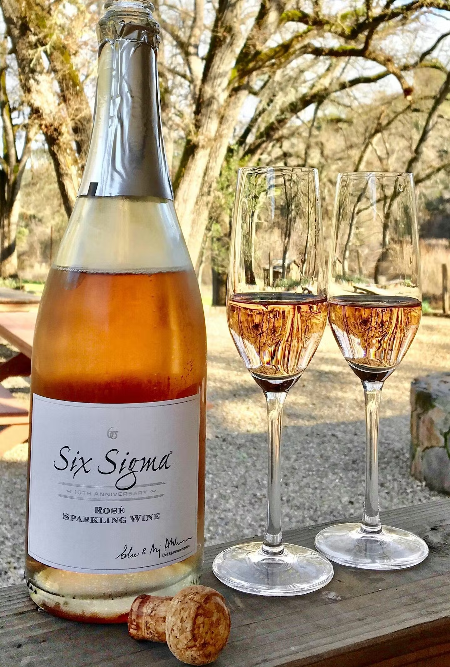 Rose bottle and two glasses