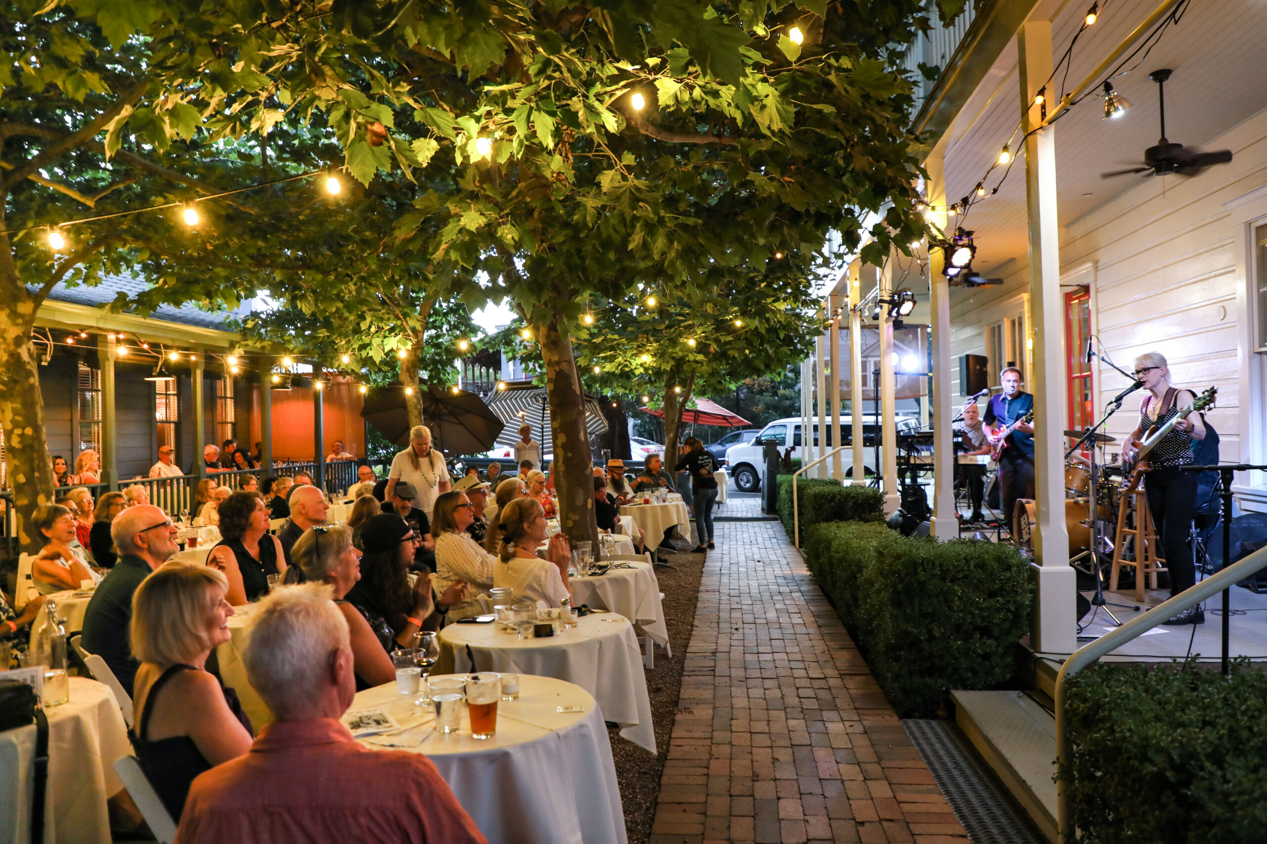 People watching music at the Tallman Hotel
